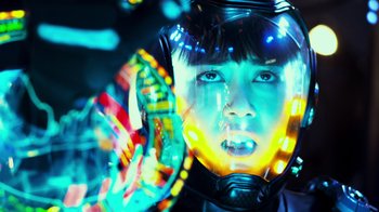 Movie still from “Pacific Rim” (2013), directed by Guillermo del Toro – A young boy wearing a helmet and a colorful light up helmet; Close Up shot, Low angle