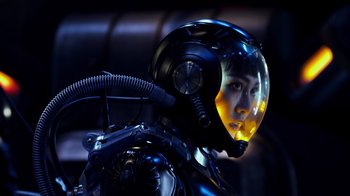 Movie still from “Pacific Rim” (2013), directed by Guillermo del Toro – A man in a helmet is standing in the dark; Close Up shot, Low angle