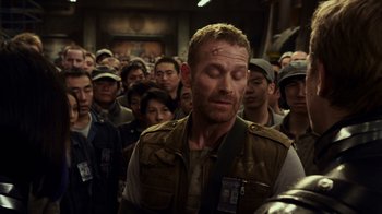 Movie still from “Pacific Rim” (2013), directed by Guillermo del Toro – A crowd of people standing in a room; Medium shot, High angle