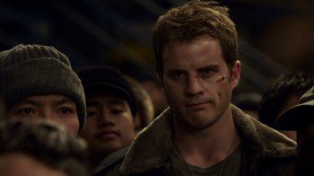 Movie still from “Pacific Rim” (2013), directed by Guillermo del Toro – A person with a scar on his face; Close Up shot, Low angle