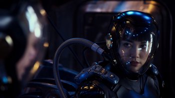 Movie still from “Pacific Rim” (2013), directed by Guillermo del Toro – A person in a space suit with a helmet on; Close Up shot, Low angle