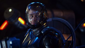 Movie still from “Pacific Rim” (2013), directed by Guillermo del Toro – A man in a space suit with a gas mask on; Close Up shot, Over the shoulder angle