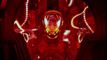 Movie still from “Pacific Rim” (2013), directed by Guillermo del Toro – A man in a space suit with lights in the background; Close Up shot, Low angle