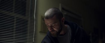 Movie still from “Palmer” (2021), directed by Fisher Stevens – A person with a shaved head; Close Up shot, Low angle