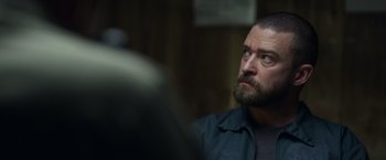 Movie still from “Palmer” (2021), directed by Fisher Stevens – A person with a beard; Close Up shot, Over the shoulder angle