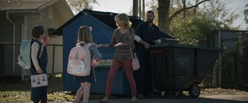 Movie still from “Palmer” (2021), directed by Fisher Stevens – A woman and a girl shaking hands with a man; Medium shot, Over the shoulder angle