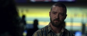 Movie still from “Palmer” (2021), directed by Fisher Stevens – A person wearing a plaid shirt; Close Up shot, Over the shoulder angle