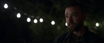 Movie still from “Palmer” (2021), directed by Fisher Stevens – A person with a beard; Close Up shot, Over the shoulder angle