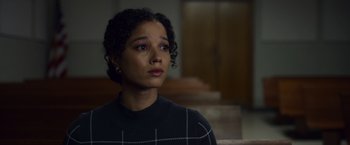 Movie still from “Palmer” (2021), directed by Fisher Stevens – A woman in a black shirt is looking at the camera; Close Up shot, Low angle