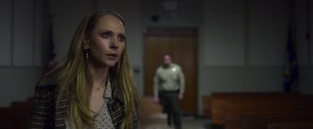Movie still from “Palmer” (2021), directed by Fisher Stevens – A woman standing next to a man in front of a door; Close Up shot, Over the shoulder angle