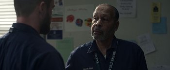 Movie still from “Palmer” (2021), directed by Fisher Stevens – An older man in a blue shirt is looking at himself in the mirror; Close Up shot, Over the shoulder angle