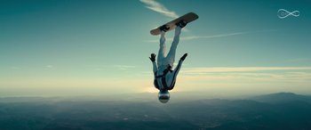 A man is doing a trick on a skateboard