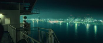 A view of a city at night from a balcony