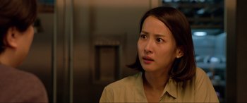 Movie still from “Parasite” (2019), directed by Bong Joon Ho – A person wearing a shirt; Close Up shot, Over the shoulder angle