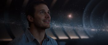 Movie still from “Passengers” (2016), directed by Morten Tyldum – A man looking up into the night sky; Close Up shot, Over the shoulder angle