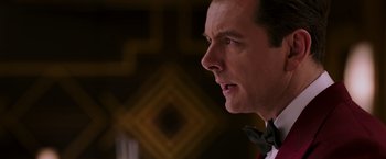 Movie still from “Passengers” (2016), directed by Morten Tyldum – A person wearing a bow tie; Close Up shot, Over the shoulder angle