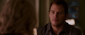 Movie still from “Passengers” (2016), directed by Morten Tyldum – A person sitting in front of another person; Close Up shot, Over the shoulder angle