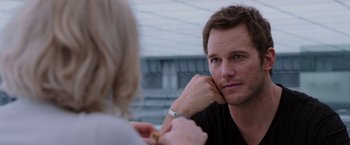 Movie still from “Passengers” (2016), directed by Morten Tyldum – A man and a woman are talking to each other; Close Up shot, Over the shoulder angle