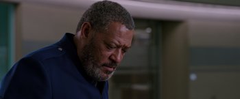 Movie still from “Passengers” (2016), directed by Morten Tyldum – An older man with a beard is looking down; Close Up shot, Low angle