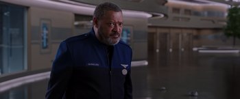 Movie still from “Passengers” (2016), directed by Morten Tyldum – A man with a beard wearing a blue jacket; Close Up shot, Over the shoulder angle