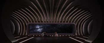 Movie still from “Passengers” (2016), directed by Morten Tyldum – Two people are sitting in front of a large window; Extreme Wide shot, Overhead angle