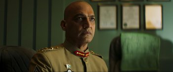 Movie still from “Pathaan” (2023), directed by Siddharth Anand – A man in a military uniform looking to his left; Close Up shot, Low angle