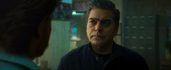 Movie still from “Pathaan” (2023), directed by Siddharth Anand – A person looking at a mirror; Close Up shot, Over the shoulder angle