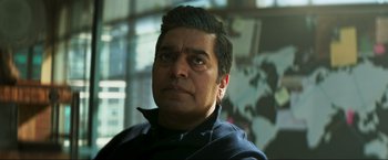 Movie still from “Pathaan” (2023), directed by Siddharth Anand – A person wearing a black shirt; Close Up shot, Low angle