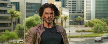 Movie still from “Pathaan” (2023), directed by Siddharth Anand – A man with blood all over his face; Close Up shot, Over the shoulder angle