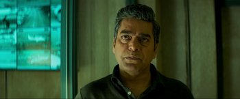 Movie still from “Pathaan” (2023), directed by Siddharth Anand – A person wearing a black shirt; Close Up shot, Low angle