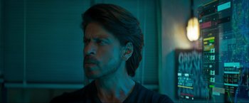 Movie still from “Pathaan” (2023), directed by Siddharth Anand – A person with long hair; Close Up shot, Low angle