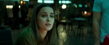 Movie still from “Pathaan” (2023), directed by Siddharth Anand – A person sitting in a room; Close Up shot, Over the shoulder angle