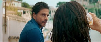 Movie still from “Pathaan” (2023), directed by Siddharth Anand – A person wearing a blue shirt; Close Up shot, Over the shoulder angle