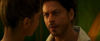 Movie still from “Pathaan” (2023), directed by Siddharth Anand – A person with his face close to a woman; Extreme Close Up shot, Over the shoulder angle