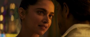 Movie still from “Pathaan” (2023), directed by Siddharth Anand – A woman's face in the dark; Extreme Close Up shot, Over the shoulder angle