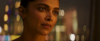 Movie still from “Pathaan” (2023), directed by Siddharth Anand – A woman's face in the dark; Close Up shot, Over the shoulder angle