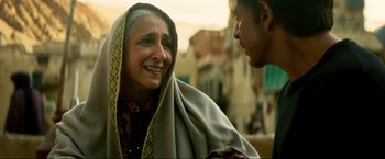 Movie still from “Pathaan” (2023), directed by Siddharth Anand – An older woman is talking to an older man; Close Up shot, Over the shoulder angle