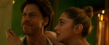Movie still from “Pathaan” (2023), directed by Siddharth Anand – Deepika padukone and shah rukh khan in a scene from ' jab harry met sejal '; Close Up shot, Over the shoulder angle