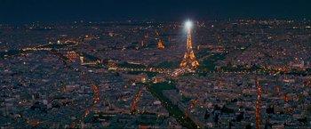 Movie still from “Pathaan” (2023), directed by Siddharth Anand – An aerial view of the eiffel tower at night; Extreme Wide shot, High angle