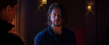 Movie still from “Pathaan” (2023), directed by Siddharth Anand – A person with long black hair; Close Up shot, Over the shoulder angle