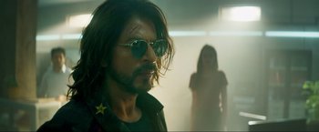 Movie still from “Pathaan” (2023), directed by Siddharth Anand – A man with a star on his forehead and a woman with a star on her shoulder; Close Up shot, Low angle