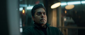 Movie still from “Pathaan” (2023), directed by Siddharth Anand – A person wearing a black jacket; Close Up shot, Low angle