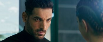 Movie still from “Pathaan” (2023), directed by Siddharth Anand – A person with a beard; Close Up shot, Over the shoulder angle