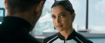 Movie still from “Pathaan” (2023), directed by Siddharth Anand – Deepika padukone in a black and white outfit; Close Up shot, Over the shoulder angle