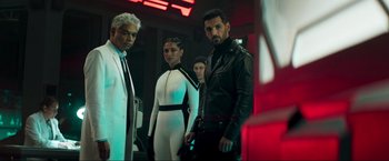 Movie still from “Pathaan” (2023), directed by Siddharth Anand – A group of people standing next to each other in a room; Medium shot, Low angle