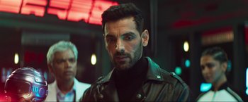 Movie still from “Pathaan” (2023), directed by Siddharth Anand – A person wearing a leather jacket; Close Up shot, Over the shoulder angle