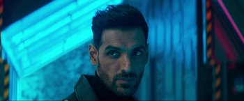 Movie still from “Pathaan” (2023), directed by Siddharth Anand – A person wearing a jacket; Close Up shot, Low angle