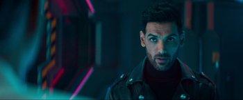 Movie still from “Pathaan” (2023), directed by Siddharth Anand – A person wearing a jacket; Close Up shot, Over the shoulder angle