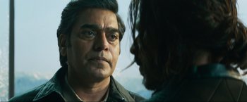 Movie still from “Pathaan” (2023), directed by Siddharth Anand – A person talking to another person; Close Up shot, Over the shoulder angle