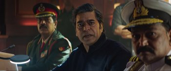 Movie still from “Pathaan” (2023), directed by Siddharth Anand – A person wearing a black shirt; Close Up shot, Over the shoulder angle